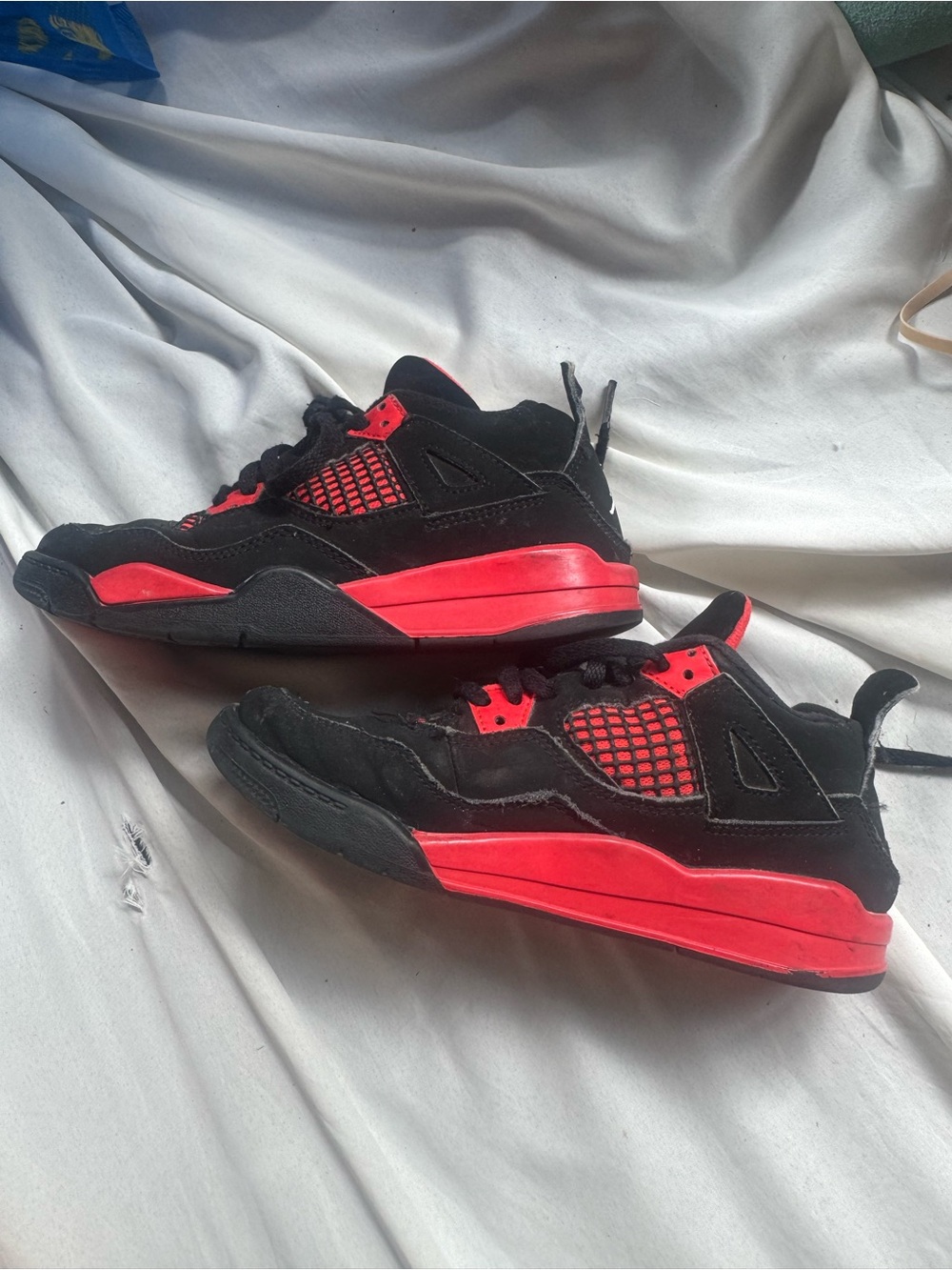 Kids Black and Red Jordan 4s Athletic Sneakers